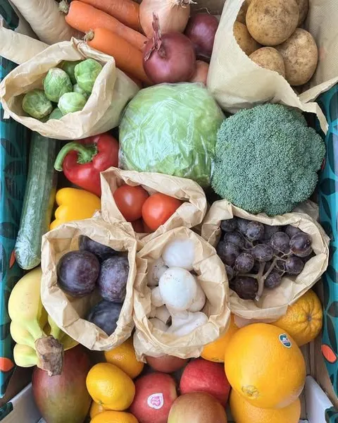 A seasonal fruit and veg box from Parade Fruiterers, West Ealing: cabbage, broccoli, peppers, tomatoes, plums, grapes, mushrooms, carrots and potatoes