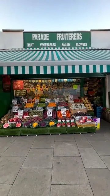 Parade Fruiterers greengrocer shop front on Mattock Lane, West Ealing, stocked for the day