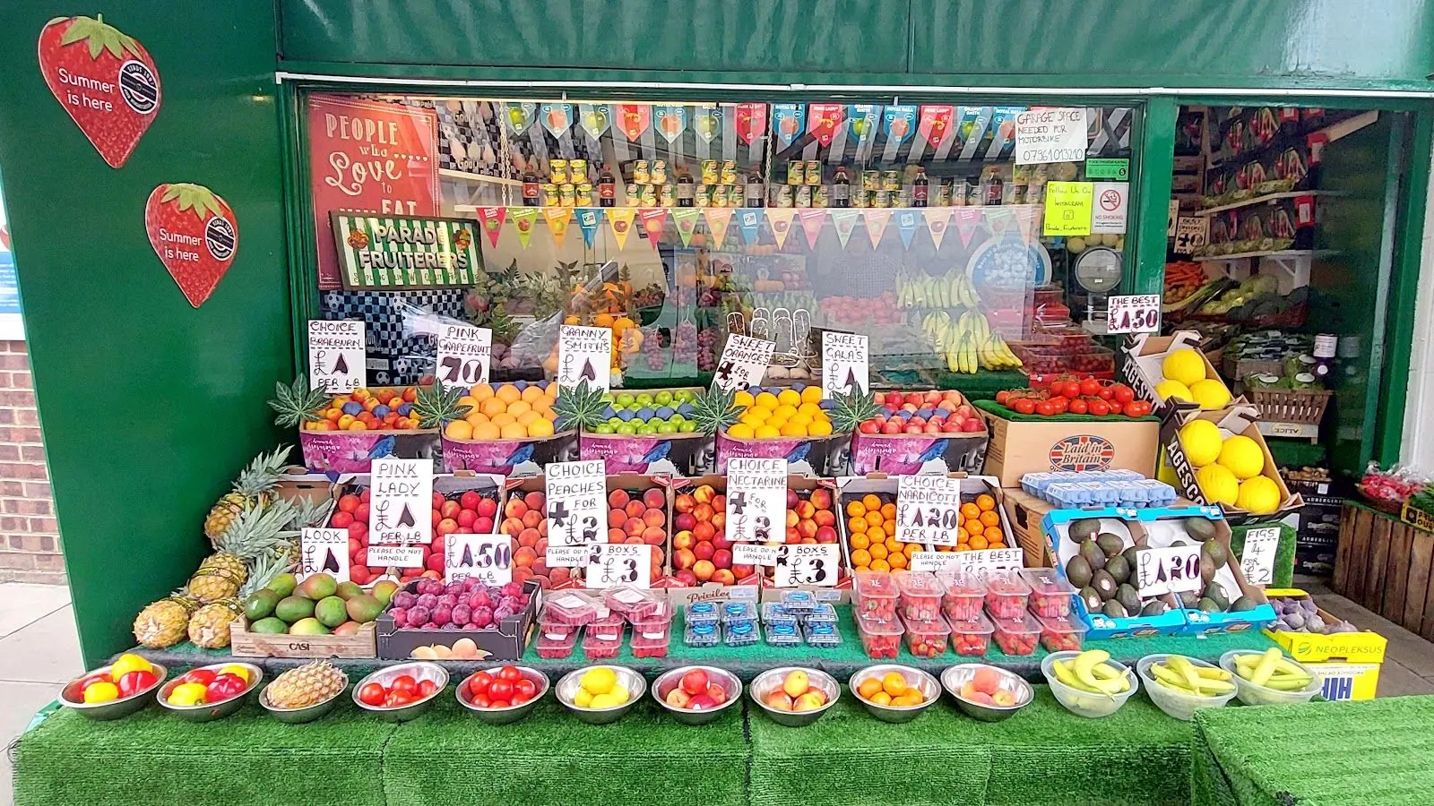 The full fruit and veg display outside Parade Fruiterers, greengrocer on Mattock Lane, West Ealing