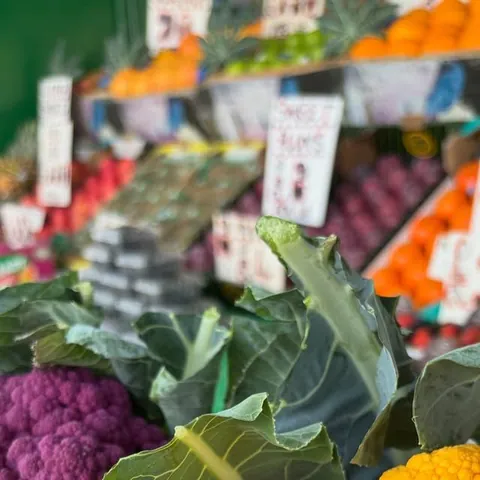 Purple and yellow cauliflowers at Parade Fruiterers, West Ealing